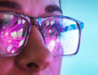 © Connect Images - Futuristic reflections in scientists eyeglasses