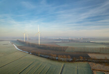 Netherlands, Noord-Brabant, Wind Farm On Cold And Foggy Morning