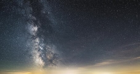 Wall Mural - starry night sky milky way galaxy time lapse astronomy stars background