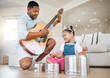 © K Abrahams/peopleimages.com - Family knows your flaws but loves you, anyway. Shot of a father and daughter playing music at home.