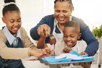 Poster - Well make extra to take home. Shot of a grandmother baking with her two grandkids at home.