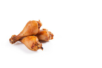 Wall Mural - Delicious baked chicken drumsticks in honey-mustard marinade isolated on white background with copy space. Created with Generative AI Technology