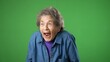 © Robert Peak - Portrait of elderly senior old woman with wrinkled skin and grey hair getting great success winner isolated over green screen background in studio. People sincere emotions, lifestyle concept.