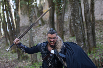 Handsome man dressed as a warrior in costume