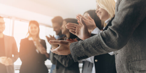 Multiracial group of business people clapping hands to congratulate their boss - Business company team, standing ovation after a successful meeting