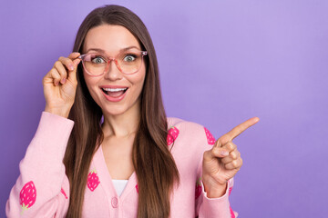 Poster - Photo of young funny girl wear cardigan with expensive glasses new spectacles shock direct finger mockup price isolated on violet color background