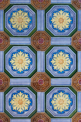 Wall Mural - Rows of antique nyonya tiles with flowers with purple background. Vintage wall tile in penang.