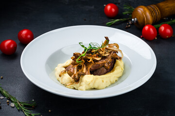 Sticker - Slices of beef meat with mashed potatoes, fried onions, sauce and greens.