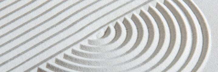Japanese zen garden with stone in textured sand