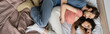 © LIGHTFIELD STUDIOS - Top view of displeased man hugging girlfriend in pajama on bed, banner.