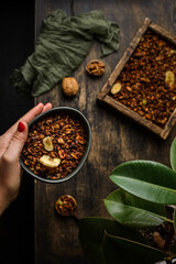 Wall Mural - granola on a dark wooden background