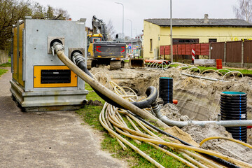 Large mobile diesel powered water pump for dewatering of deep underground piping replacement trench