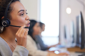 Canvas Print - Shes equipped with all the knowledge to make big sales. Shot of a young call centre agent working in an office.