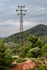 High voltage electric line through hills.