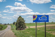 Kansas Welcomes You - Welcome Roadside Sign With A Popular Latin Phrase Ad Astra Per Aspera (through Hardships To The Stars), Driving And Travel Concept
