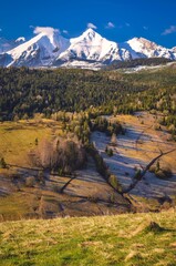 Wall Mural - Beautiful morning spring landscape in the countryside. View of the Belianske Tatras from the village of Osturna in Slovakia.