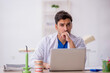© Elnur - Young male dentist working in the clinic