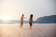 © DavidPrado - Happy couple running on tropical romantic beach
