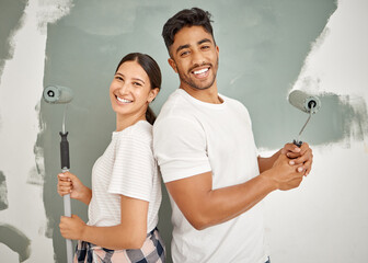 Canvas Print - Were bringing this room to life. Shot of a young couple painting a room together.