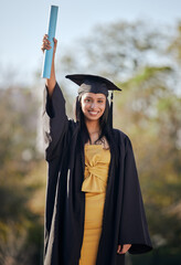 Poster - Go after your dreams. Portrait of a young woman holding her diploma on graduation day.