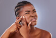 © Alexis Scholtz/peopleimages.com - They just pop up and ruin my day. Shot of a young woman squeezing a pimple on her face.