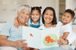 © K Abrahams/peopleimages.com - Tested by everything, and each uniquely ours. Shot of a family reading a story book together at home.
