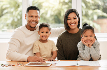 Poster - Learning together. Shot of a young family doing homework together at home.