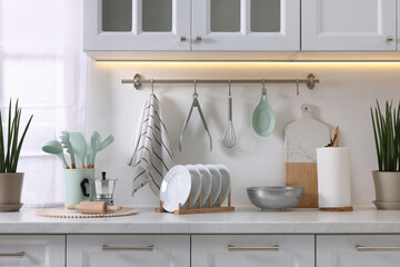 Wall Mural - Set of different utensils and dishes on countertop in kitchen