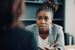 © Trinette Reed - Black business woman interviewing someone for a job. Generative AI.
