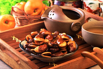 Wall Mural - Roasted salted broad beans on a plate on wooden table