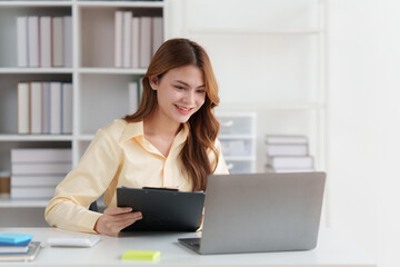 Wall Mural - Accountant woman working on digital tablet and do document, tax, exchange, research, accounting and Financial advisor concept