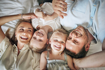 Canvas Print - Side by side, heart to heart. Portrait of a beautiful young family talking and bonding in bed together.