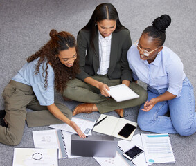 Canvas Print - Putting our brilliant minds together. Shot of a team of businesswomen working together during a meeting.