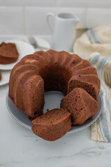 Wall Mural - Chocolate Bundt Cake and a slice on a plate