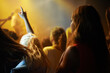 Back of woman in crowd, fan at concert or music festival watching rock event on stage. Girl in audience, excited fans at live band performance in arena or stadium with lights and energy at night show