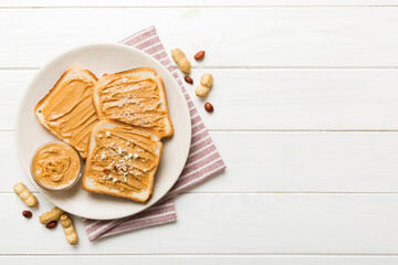 peanut butter sandwiches or toasts on light table background.breakfast. vegetarian food. american cu