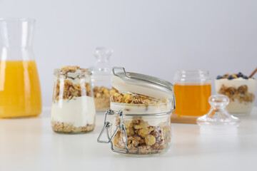 Wall Mural - Tasty and nutritious breakfast concept - muesli with yogurt