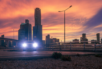 Wall Mural - Sunset over large buildings equipped with the latest technology, King Abdullah Financial District, in the capital, Riyadh, Saudi Arabia