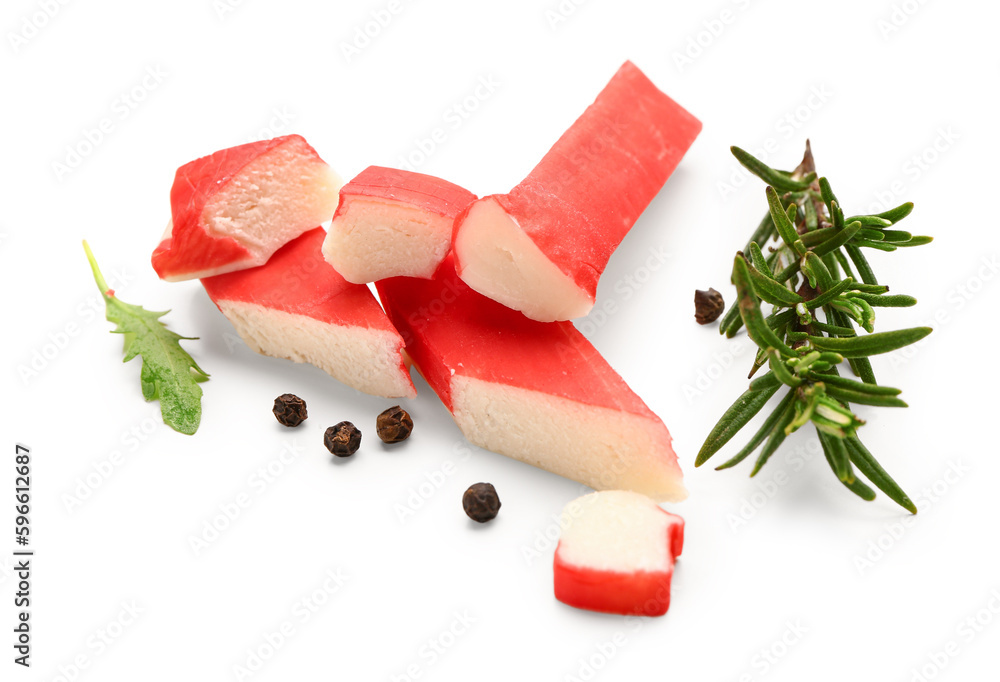 Tasty crab sticks and rosemary on white background