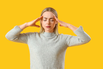 Poster - Thoughtful young woman on yellow background