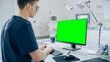 © Gorodenkoff - Veterinary Clinic Doctor Working on a Desktop Computer with Green Screen Mock Up Display