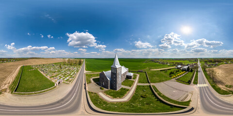 Wall Mural - full hdri 360 panorama aerial view of nordic neo gothic catholic church in countryside near graveyard in equirectangular projection with zenith and nadir. VR  AR content