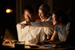 © Nina L/peopleimages.com - The solution is right there. Shot of a group of businesspeople working together on a computer in an office at night.