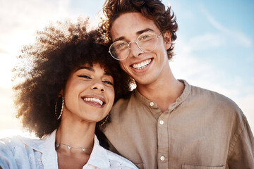 Wall Mural - Portrait of a young mixed race couple enjoying a day at the beach looking happy and in love. Portrait of a young mixed race couple enjoying a day at the beach looking happy and in love.