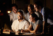 © Nina L/peopleimages.com - Glad to see everything coming together so well. Shot of a group of businesspeople working together on a computer in an office at night.