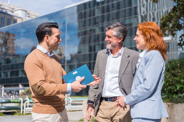 Group executives or businessmen and businesswoman in a business area. Chatting at work break