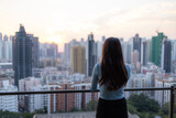 Fototapeta Miasta - Woman enjoy the city view in Hong Kong