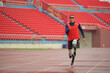 © FotoArtist - athlete runner physically disabled run on track of stadium