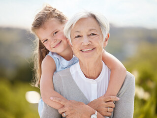 Sticker - All happy families are alike. Shot of an elderly woman spending time outdoors with her granddaughter.