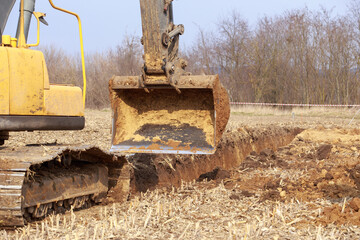 Excavator boom and bucket